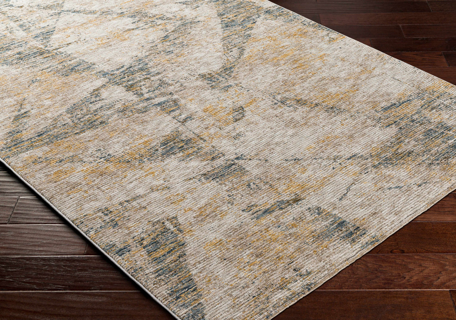 Close up of the Cadao Rich Textured Traditional Rug showing its light peach, mocha, and blue pattern. Corner