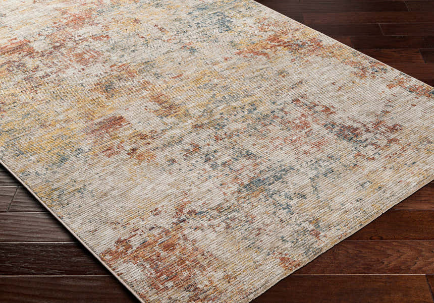 Close-up of the Chas Tan Rich Textured Traditional Rug showing bone, clay, and dark gray tones. Corner