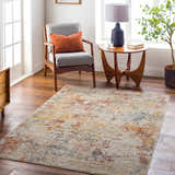 Living room scene with the Chas Tan Rich Textured Traditional Rug, gray chair, and wood accents. Roomscene-Rectangle