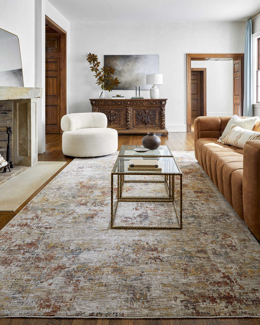Living room with a tan sofa and Chas Tan Rich Textured Traditional Rug. Roomscene-Rectangle