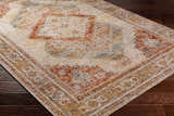 Close-up of the Moya Tan Rich Textured Traditional Rug showing bone, clay, and brown tones. Corner