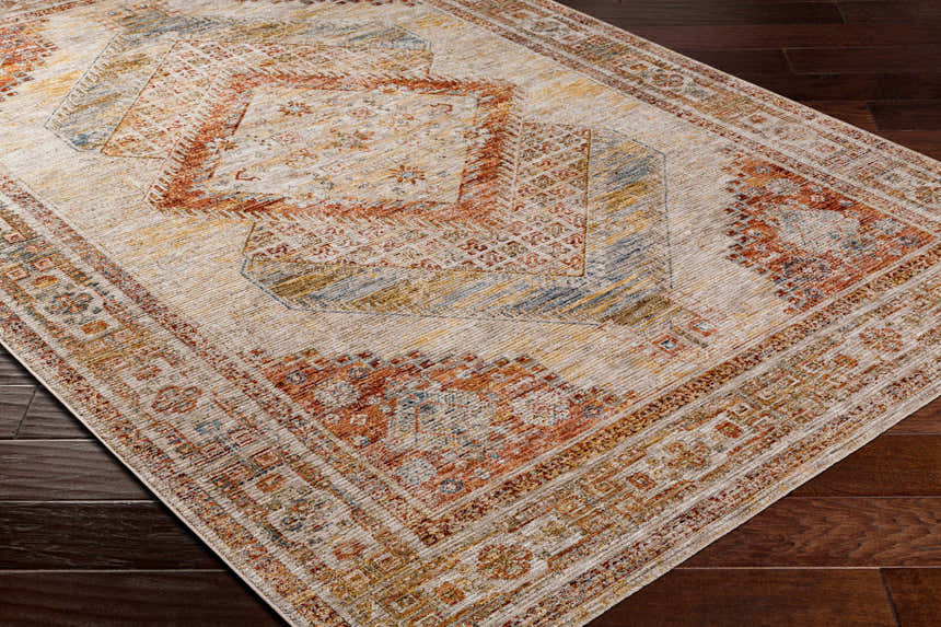 Close-up of the Moya Tan Rich Textured Traditional Rug showing bone, clay, and brown tones. Corner