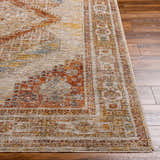 Close-up of the Moya Tan Rich Textured Traditional Rug, showing bone, clay, and brown tones on wood floors. Front