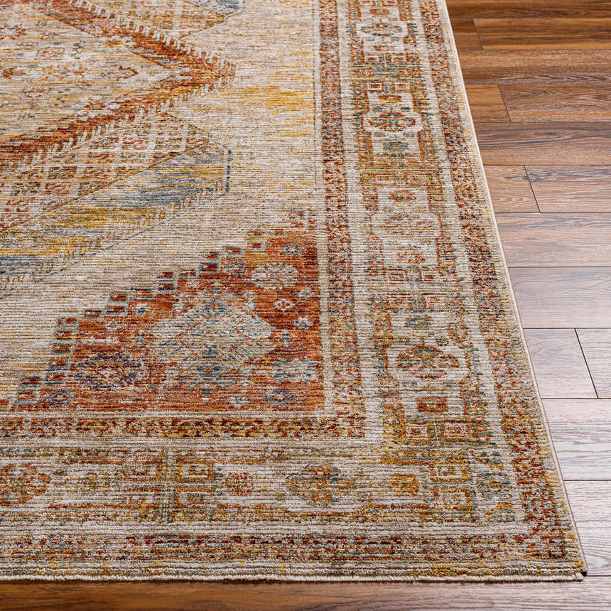Close-up of the Moya Tan Rich Textured Traditional Rug, showing bone, clay, and brown tones on wood floors. Front