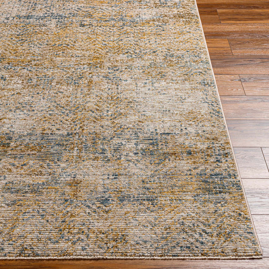 Close-up of the textured Sava Tan Rich Textured Rug showing bone, tan, and blue tones on wood floors. Front
