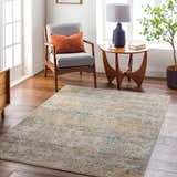 Living room scene with a Sava Tan Rich Textured Rug, gray chair, wood side table, and hardwood floors. Roomscene-Rectangle