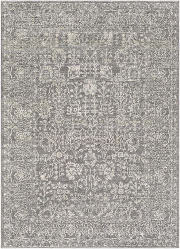 Close-up of the Sigel Area Rug. Charcoal, gray, and light beige tones create a vintage, traditional pattern. Design-Rectangle-5373