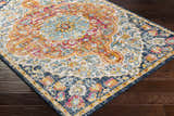 Close-up of the Silkstone Area Rug showcasing its aqua, cream, orange, and blue traditional floral pattern. Corner
