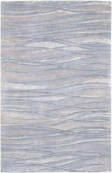 Close-up of Sinai Light Blue rug showing lined design, soft texture, and light blue, gray, and off-white colors. Design-Rectangle-58