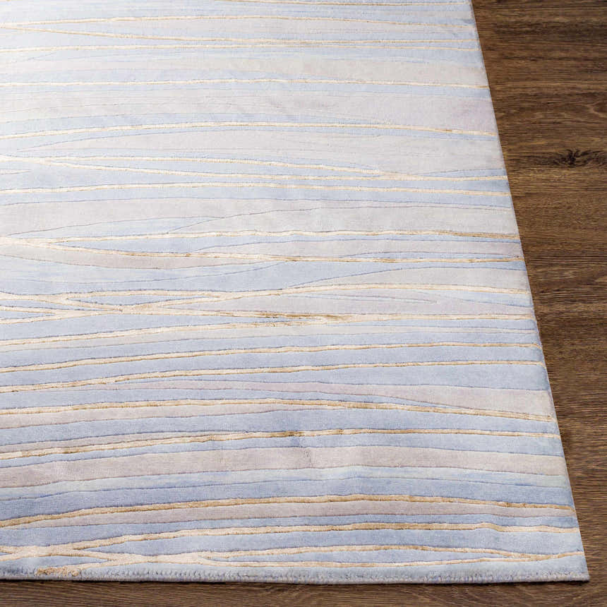 Close up of Sinai Light Blue Lined Wool Viscose Rug showing its light blue, beige and gray lined design. Front