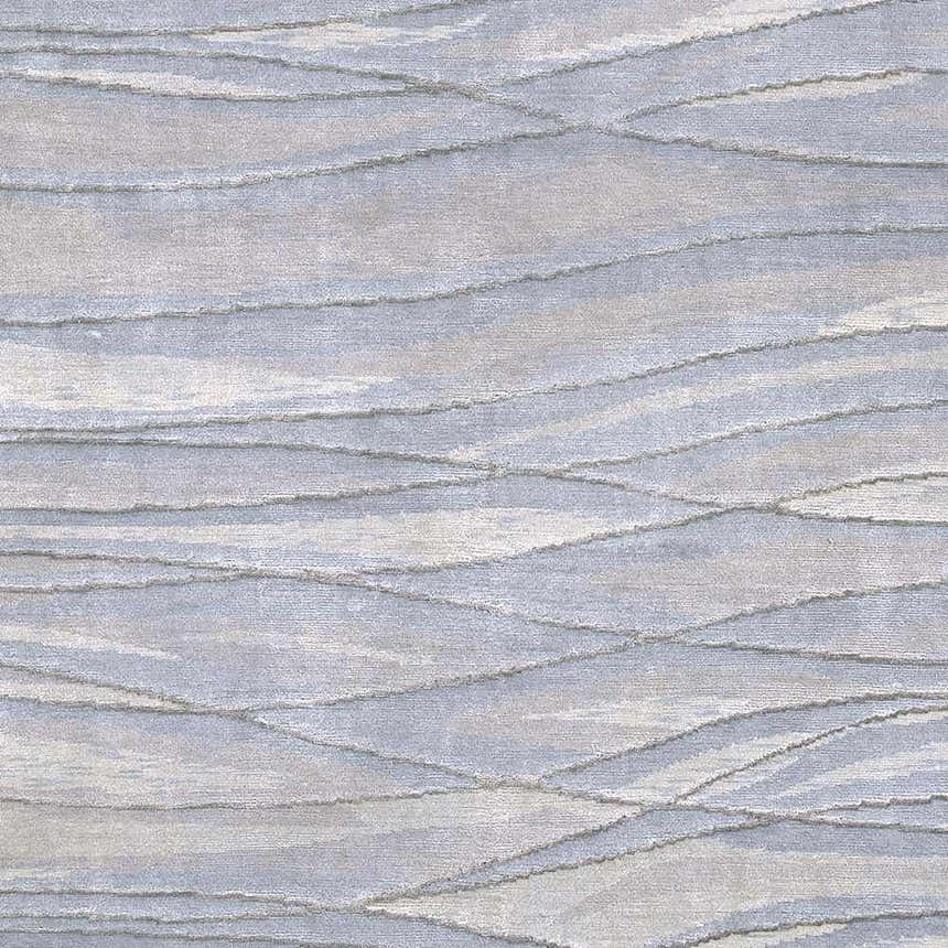 Close-up of the Sinai Light Blue rug showing its lined, wave-like pattern and wool/viscose texture. Swatch