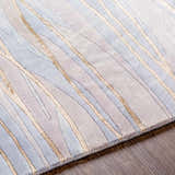 Close-up of the Sinai Light Blue rug. Lined contemporary design in light blue, brown, and off-white wool/viscose. Texture