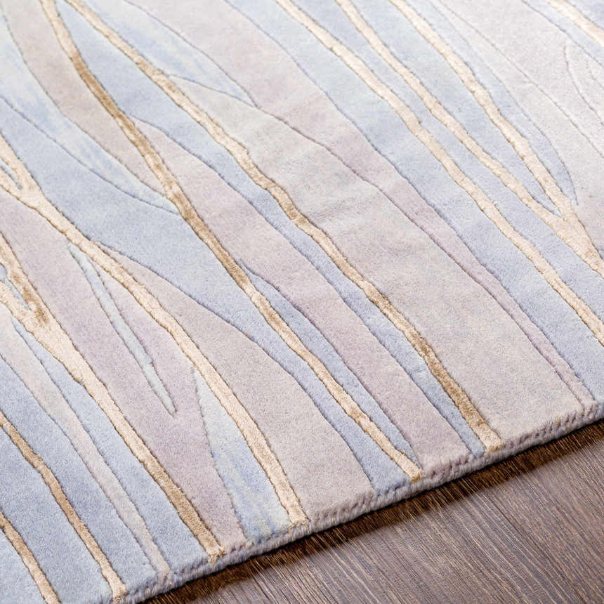 Close-up of the Sinai Light Blue rug. Lined contemporary design in light blue, brown, and off-white wool/viscose. Texture