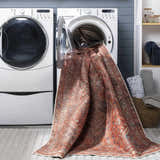 Siocon Washable Area Rug being washed in a laundry room with white washer and dryer. Farmhouse style. Washing-Machine