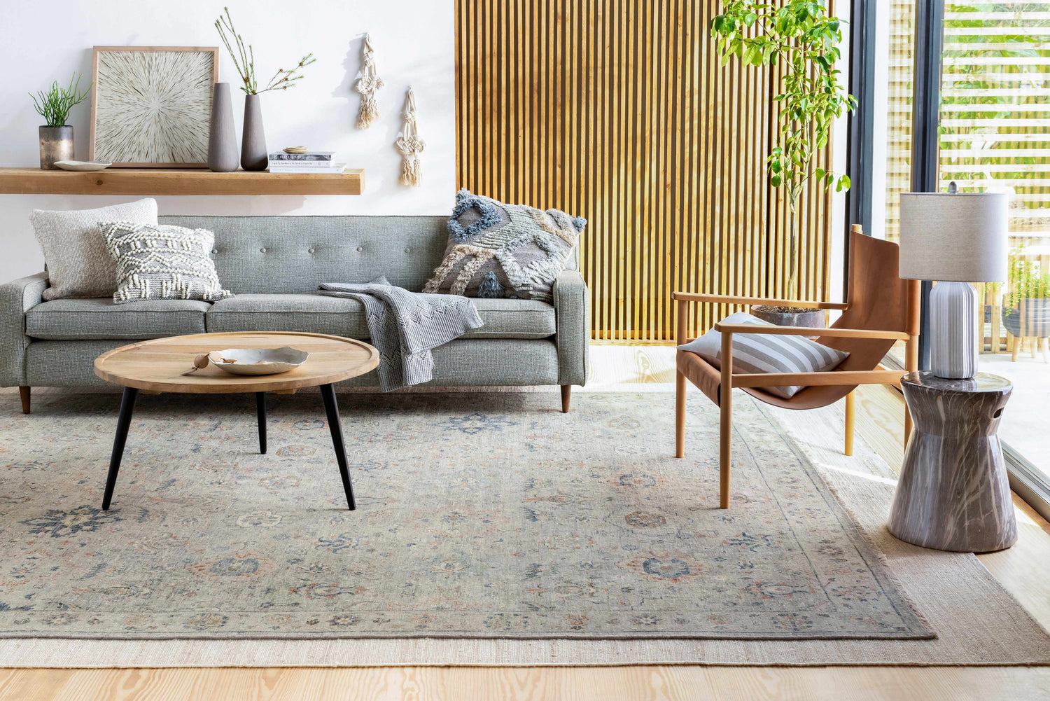Living room scene with gray sofa, wood accents, and Sipocot Premium Area Rug in beige, brick red, and navy. Roomscene-Rectangle