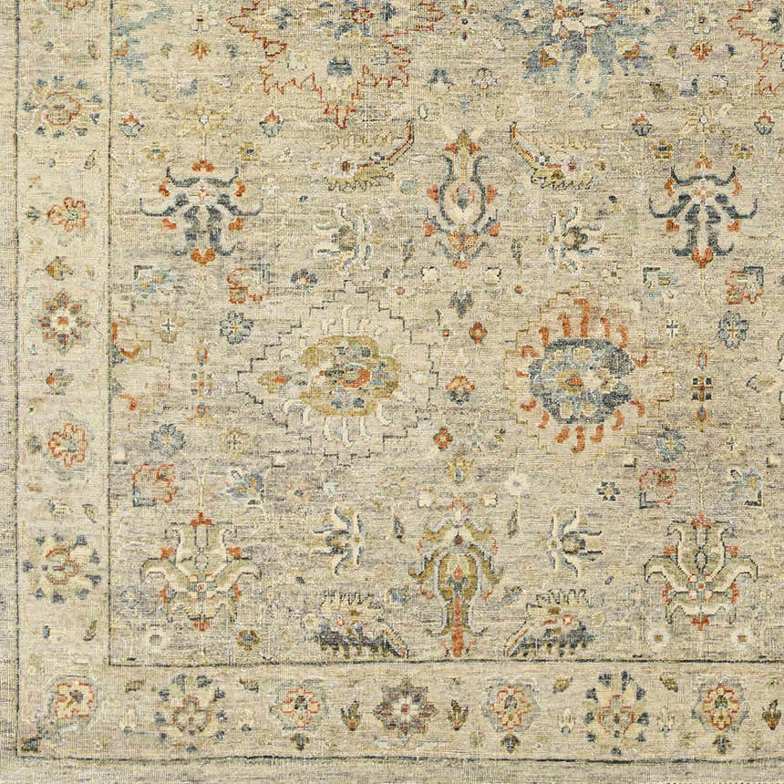 Close-up of the beige Sipocot Premium Area Rug, featuring a traditional floral pattern in rust, navy, and brown hues. Swatch