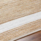 Close-up of the hand-woven Ghita White Area Rug. Jute and recycled fabric rug with dark beige and white stripes. Contemporary style. Texture