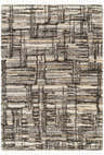 Close-up of the Arne Area Rug, a shag rug with a geometric pattern in charcoal, gray, taupe, and off-white. Tassels on the edge. Design-Rectangle-537