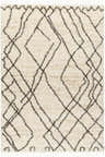 Close-up of the Hersz Cream Area Rug. Shag rug with brown geometric diamond pattern and tassels. Farmhouse style. Design-Rectangle-537