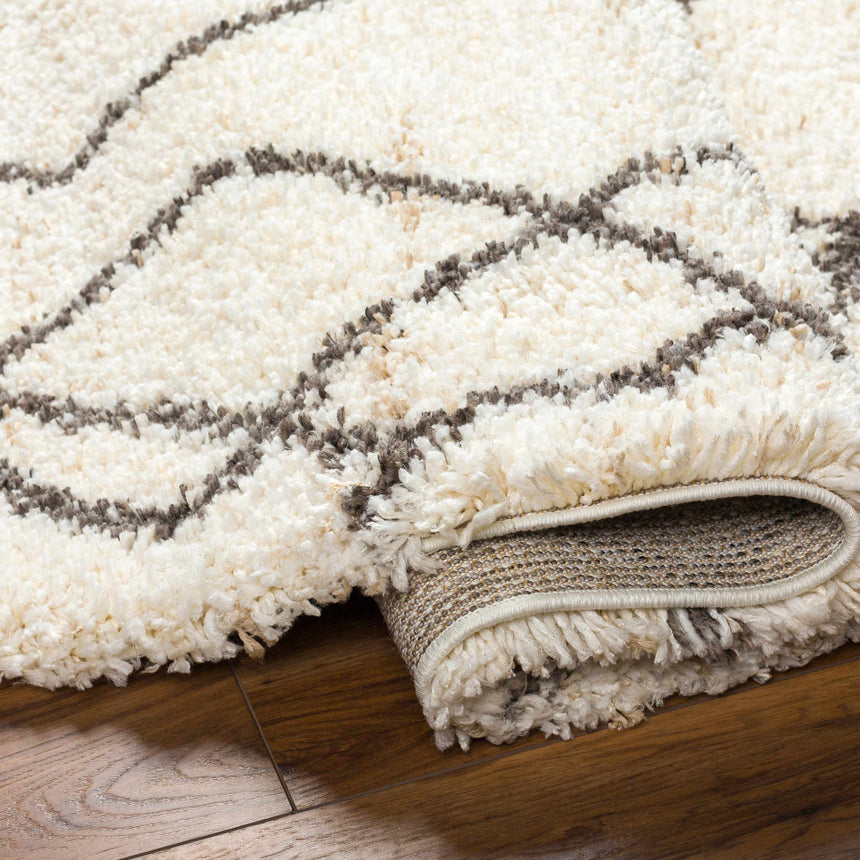 Hersz Cream Area Rug - Clearance