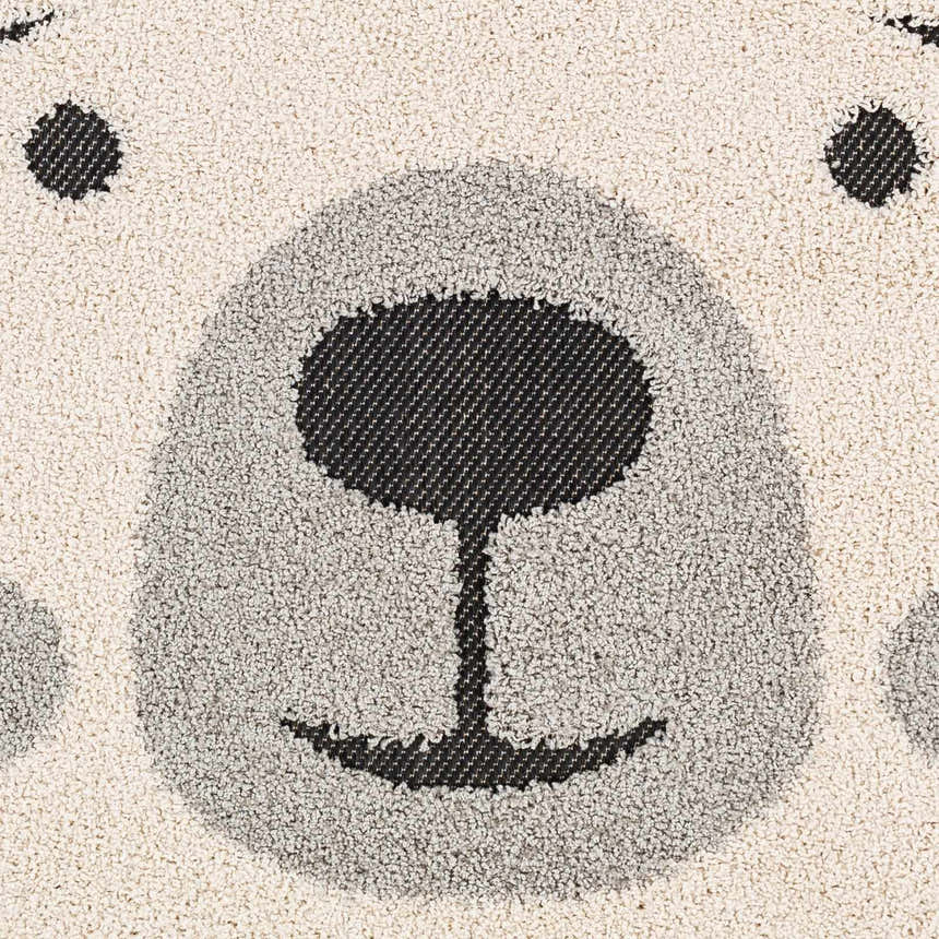 Close-up of the Kids Bear Animal Print Nursery Area Rug, featuring a cute bear face in bone, dark gray, and black. Swatch