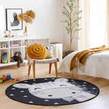 Kids room scene with a round Giraffe Bowtie Animal Print Nursery Area Rug, chair, toys, and neutral decor. Roomscene-Round