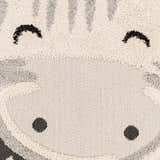 Close-up of Kids Giraffe Bowtie Animal Print Nursery Area Rug. Bone, gray, and nutmeg giraffe face design. Fun kids rug. Swatch