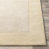 Bordered Solid Beige Wool Rug