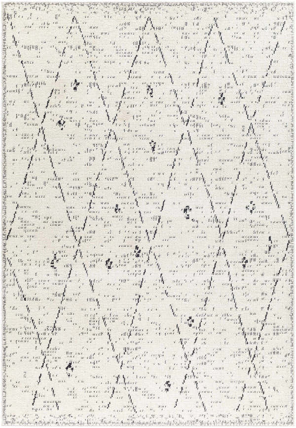 Close-up of the Dilay Area Rug, showcasing its geometric diamond pattern in dark gray and off-white. Design-Rectangle-537