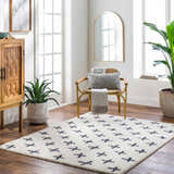 Bright living room with a Bede Washable Area Rug, beige shag with charcoal geometric cross pattern. Roomscene-Rectangle