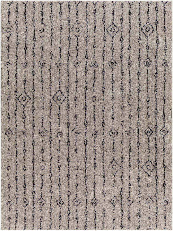 Close-up of the Demi Gray Washable Area Rug, featuring a gray shag texture and dark brown geometric vertical stripes. Design-Rectangle-537