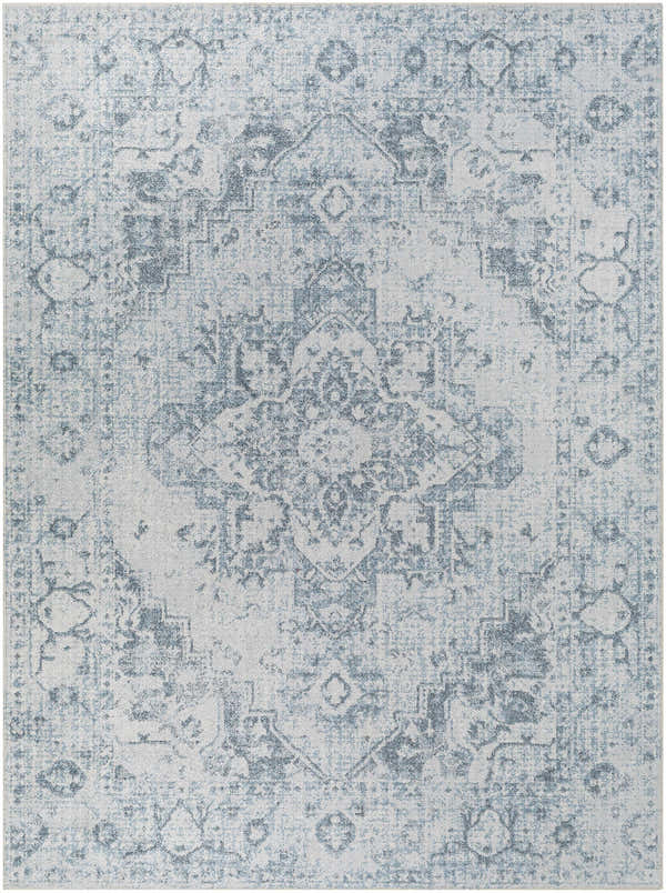 Close-up of the Ankti Aqua Washable Area Rug, featuring a traditional aqua, blue, and off-white distressed pattern. Design-Rectangle-537