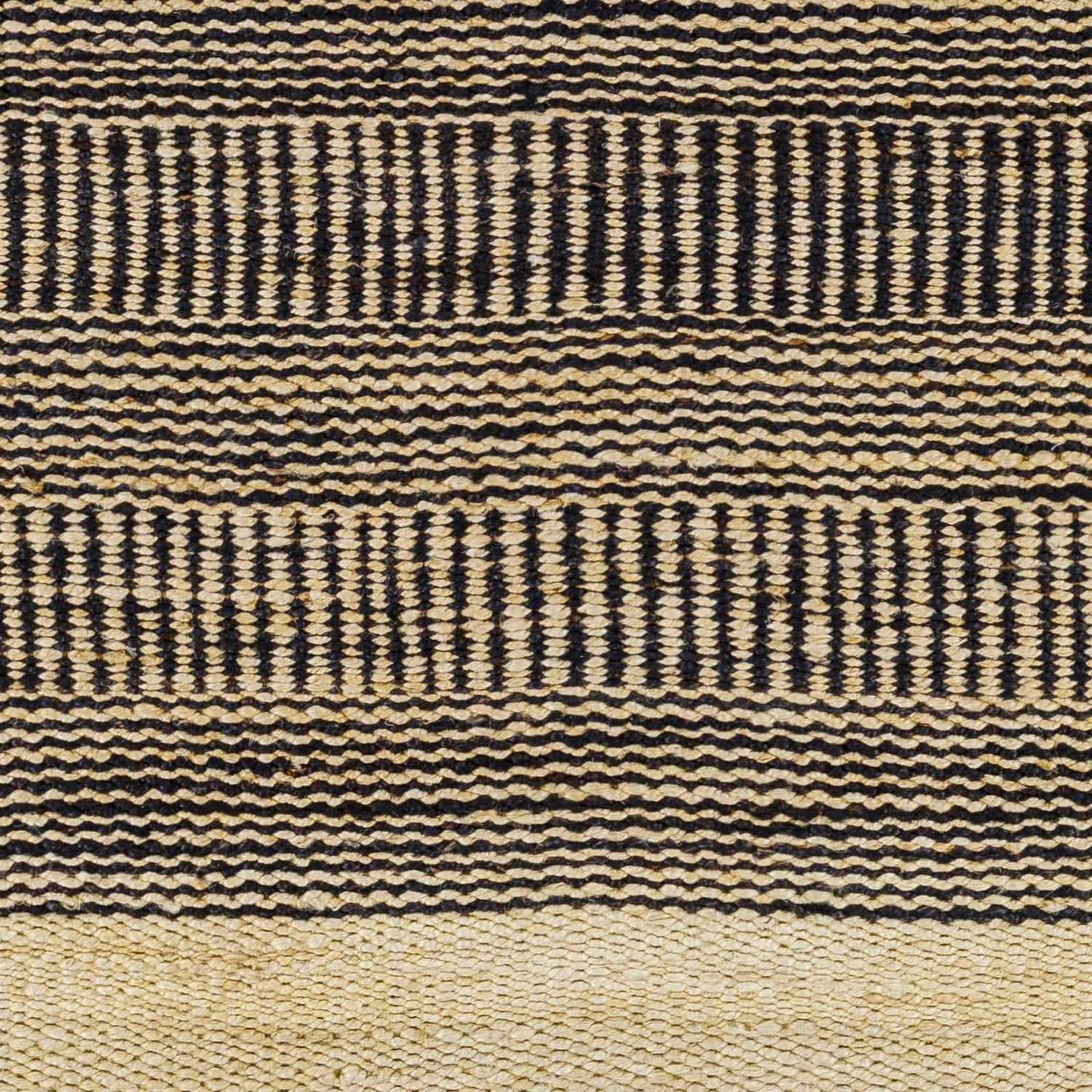 Close-up of the Black Elle Area Rug, a hand-woven jute rug with a geometric pattern in black and beige. Swatch