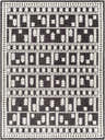Close-up of the Yama Washable Area Rug. Dark gray rug with a geometric, Scandinavian-inspired pattern in white. Machine woven texture. Design-Rectangle-57