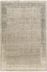 Close-up of the hand-knotted Petra 2x3 Carpet. Features dark brown, light gray, medium gray, and taupe colors. Wool texture. Design-Rectangle