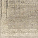 Close-up of a hand-knotted Petra 2x3 carpet. Contemporary style in dark brown, light gray, medium gray, and taupe wool. Swatch