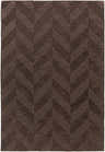 Close-up of the dark brown Summertown Area Rug, featuring a hand-loomed chevron pattern and wool texture. Design-Rectangle