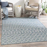 Outdoor patio scene with wicker chairs and Blue Ivory Summit Indoor & Outdoor Area Rug. Roomscene-Rectangle