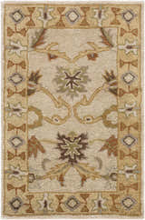 Close-up of the hand-tufted Smoot Area Rug. Beige wool rug with traditional brown, olive, and tan floral and geometric pattern. Design-Rectangle-23