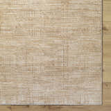 Close up of Dekan Tan Area Rug showing lambswool and light brown colors and subtle traditional pattern. Corner