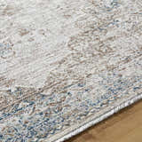 Close-up of the Kosta Beige & Blue Medallion Area Rug showing its farmhouse style pattern and soft, textured polyester. Texture