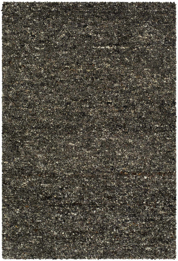 Close-up of the hand-tufted Sevan Black Wool Area Rug. Features jet black, medium gray, and taupe tones. Design-Rectangle-23