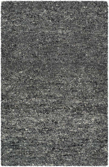 Close-up of the Sevan Charcoal Wool Area Rug. Hand-tufted rug with a looped texture in shades of black, gray, and steel gray. Design-Rectangle-23