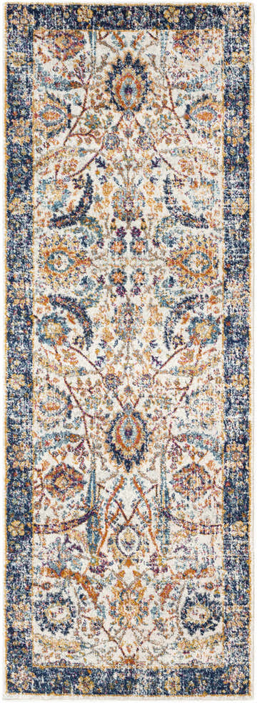 Close-up of the Smyrna Area Rug with a bohemian floral pattern in navy, beige, orange, and teal. Design-Runner-2773