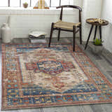 Entryway with a Southwestern style Snell Area Rug in brick red, coral, and blue tones. Roomscene-Rectangle
