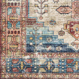 Close-up of the Snell Area Rug showing its traditional, Southwestern-inspired pattern in amber, blue, and brick red tones. Swatch