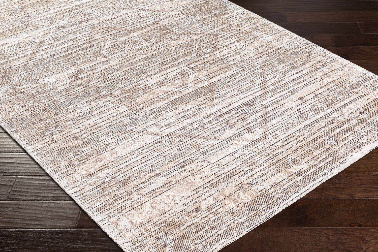 Close-up of the Elisa Area Rug on dark wood flooring. The rug has a striped pattern in lambswool, taupe, and brown. Corner
