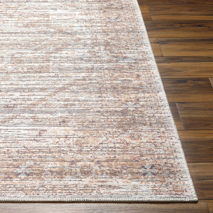 Close-up of the Elisa Area Rug showing its farmhouse style, brown tones, and subtle traditional pattern. Front