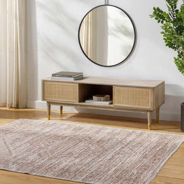 Living room scene with a taupe Elisa Area Rug, wood floors, and a light wood media console. Roomscene-Rectangle