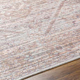Close-up of Elisa Area Rug showing its traditional pattern, lambswool, brown, and light gray colors. Machine woven texture. Texture